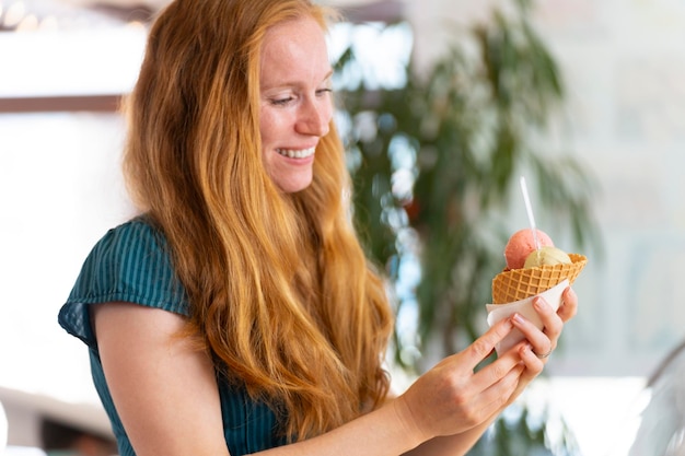 Woman buying an ice cream in a coffee shop