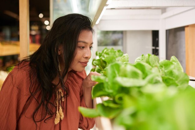 Woman Buying Lettuce