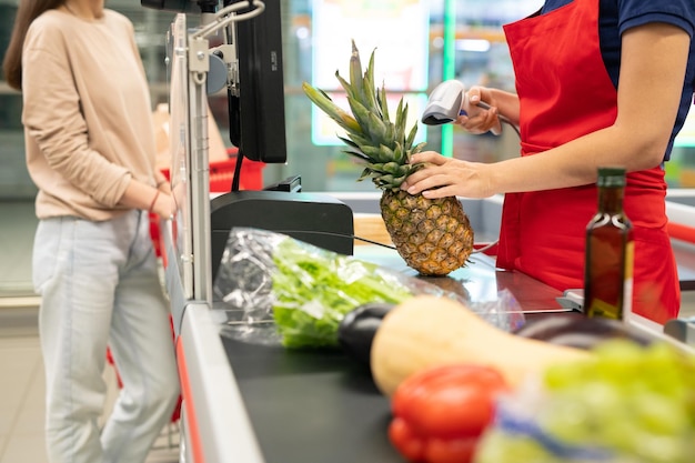 Woman buying things in supermarket