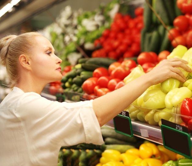 Woman buying vegetables at the market