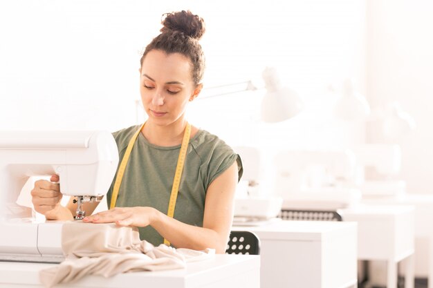 Woman by sewing machine