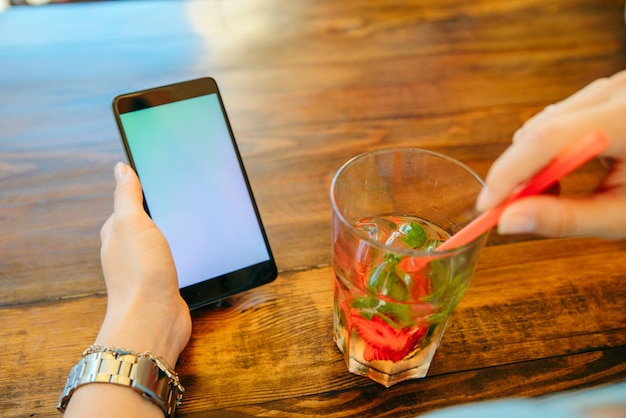 Woman in cafe drinking cool drinks close up