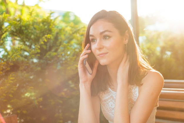 Woman at the cafeteria speak on phone