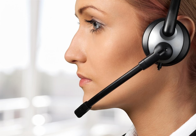 Woman Call Center operator on light background