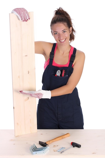 Woman carpenter holding wooden plank