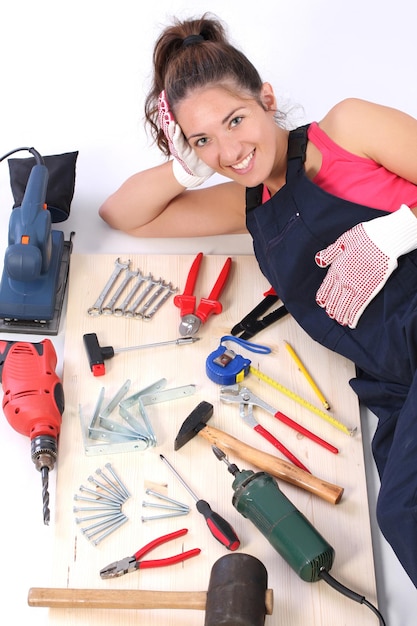 Woman carpenter with work tools