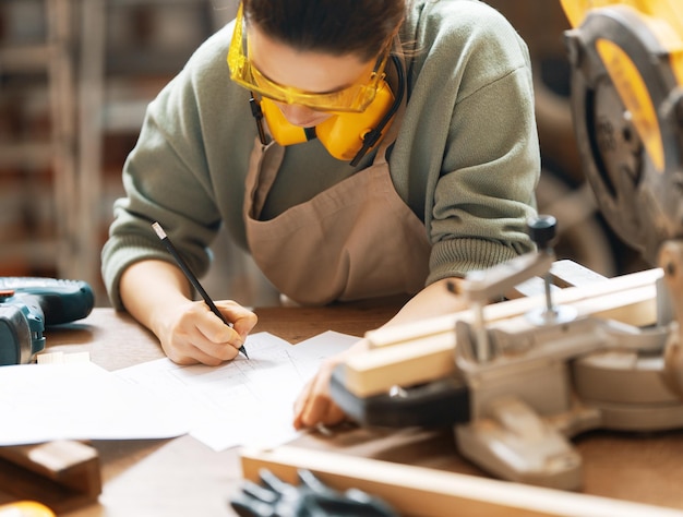 Woman carpenter in workshop