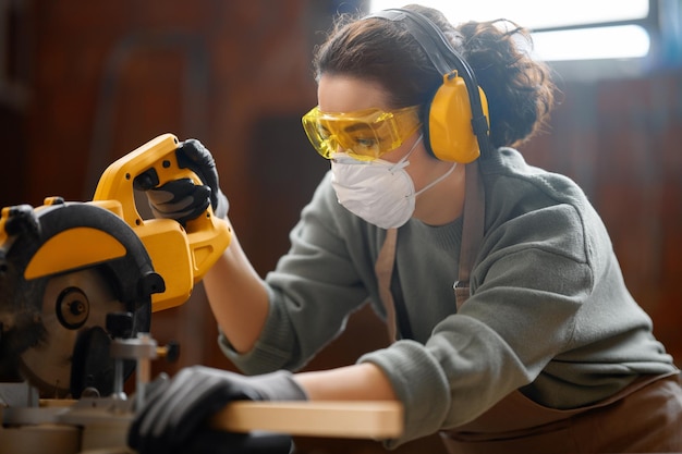 Woman carpenter in workshop