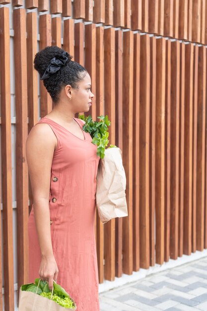 Woman Carrying Fresh Vegetables