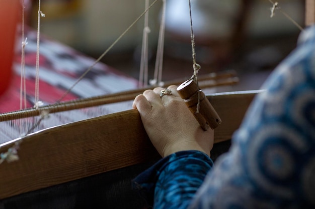 A woman carving silk cloth