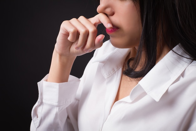 Woman catching a cold runny nose