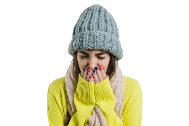 Woman caught a cold in warm hat and scarf