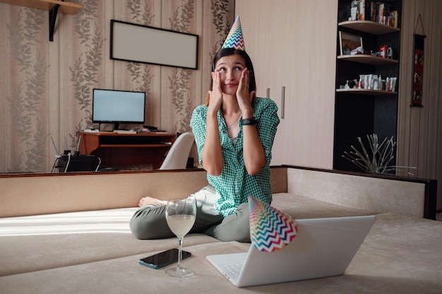 Woman celebrating birthday online in quarantine time