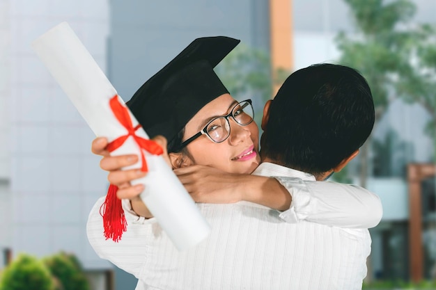 Woman celebrating graduation with her boyfriend