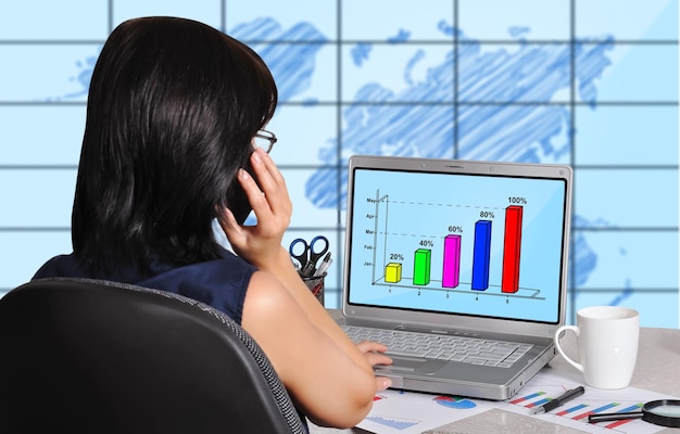 Woman and chart on screen