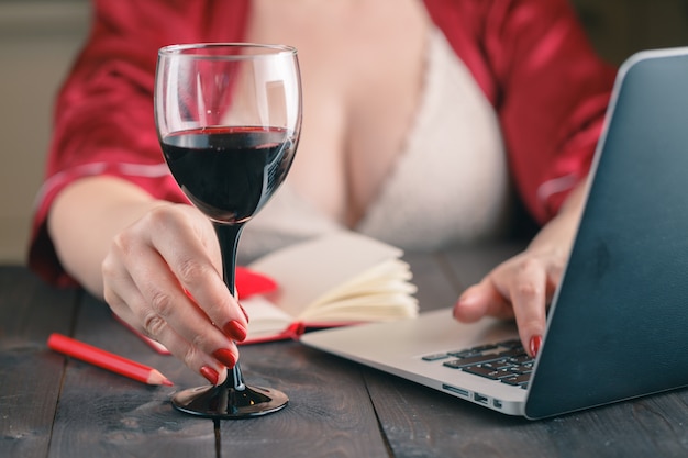 Woman Chatting On Social Networking Sites Using Laptop