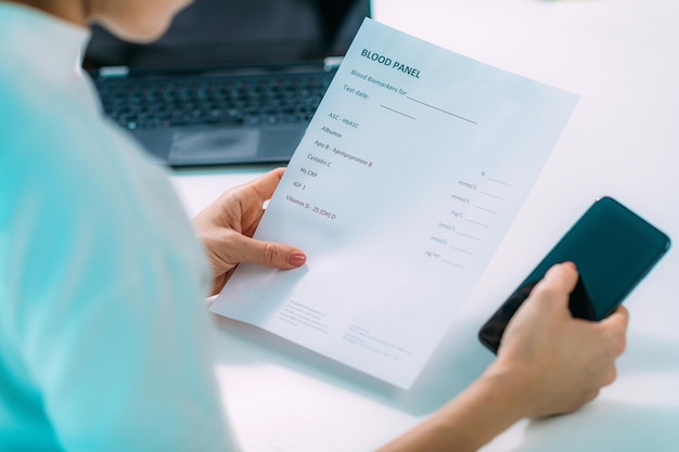 Photo woman checking her bloodwork results