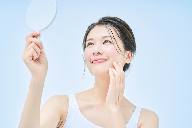 A woman checking her skin condition