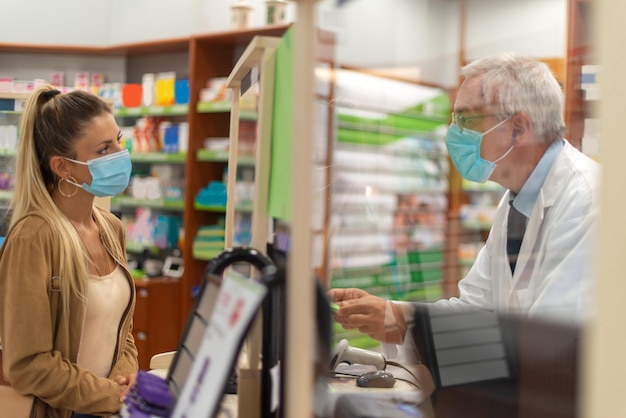 Woman checking out in a pharmacy