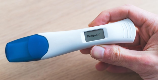 Woman checking pregnancy test Result positive Pregnant