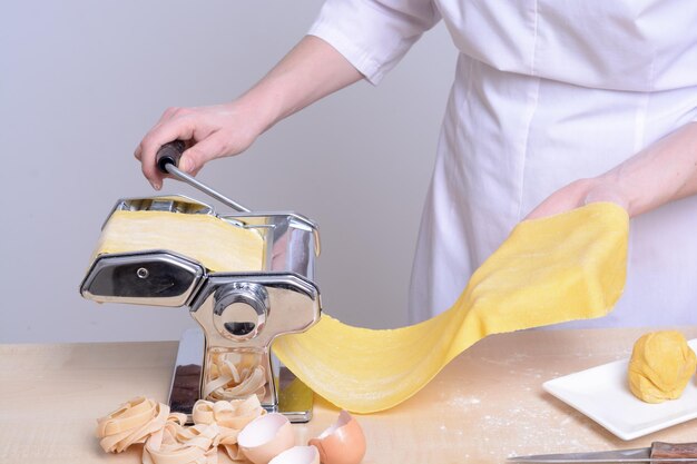 Woman chef prepares homemade pasta