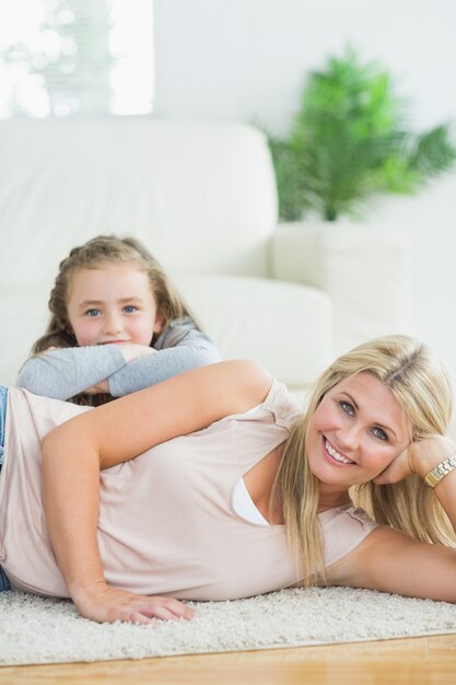 Woman and child sitting at the floor