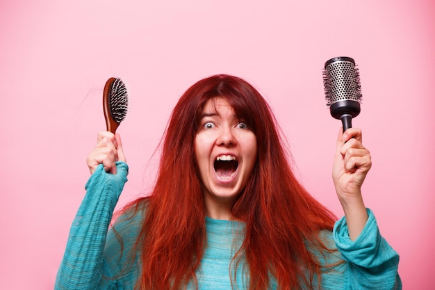 Woman choose between two combs