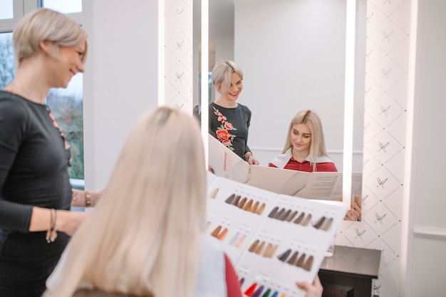 Woman choosing hair color in palette