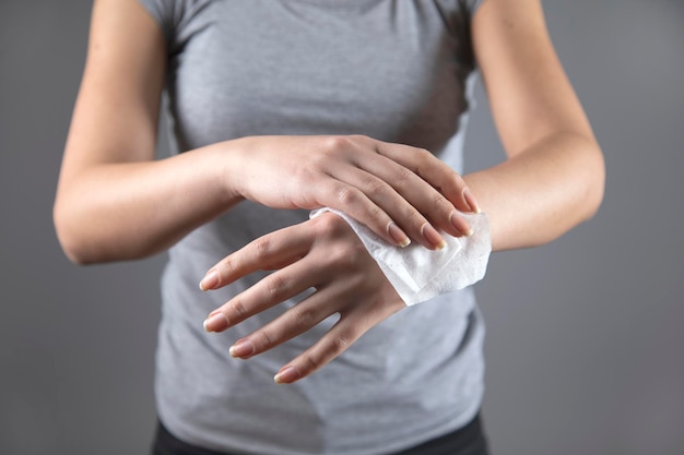 Woman clean hand in napkin