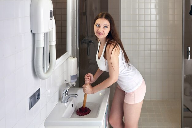 High Angle View of Woman Using Plunger in Sink Stock Image - Image of  housework, difficult: 213854807