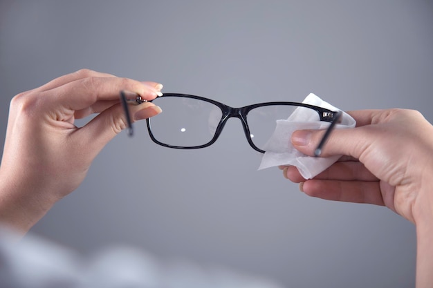 Woman cleaning glasses