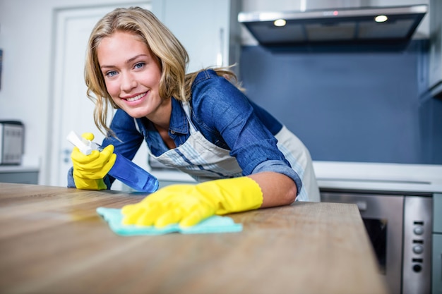 Woman cleaning up in the kitchen