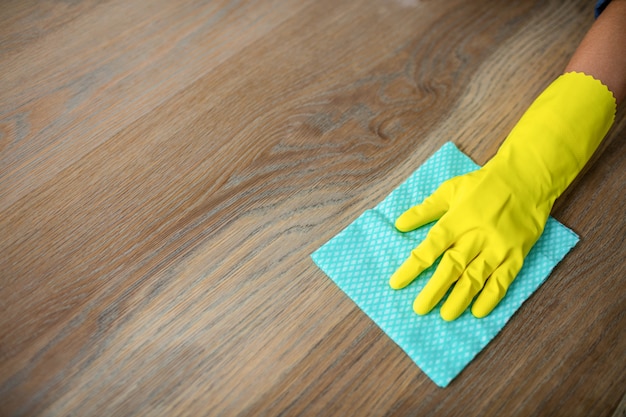 Woman cleaning up the table in the kitchen