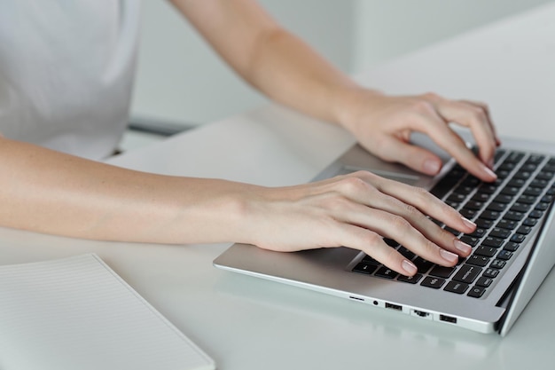 Woman Coding on Laptop