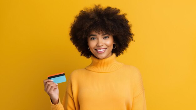 Photo woman of color holding credit card over a colorful background