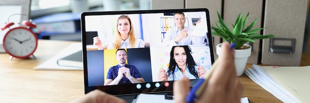 Woman communicating with colleagues via conference call on digital tablet remote meetings