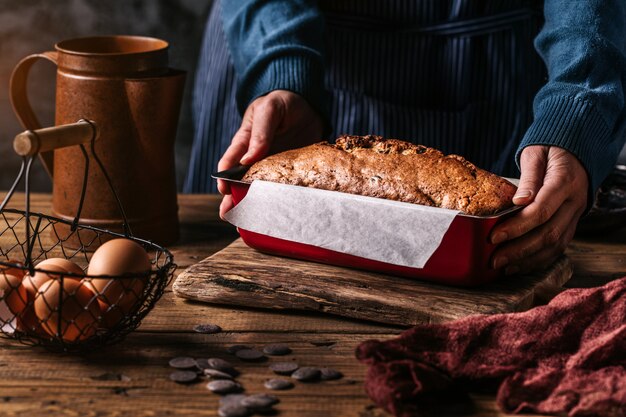 Woman composing form with baked bread