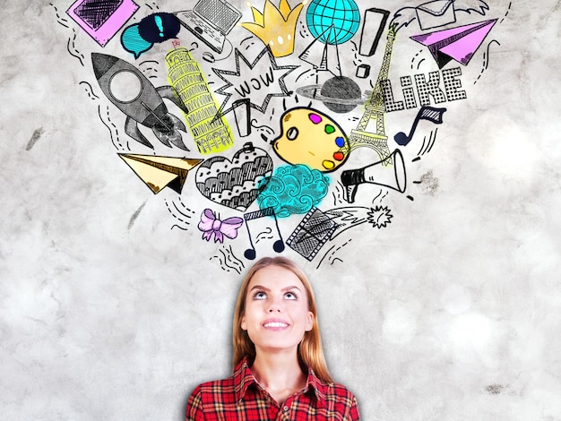 Woman on concrete background with sketches