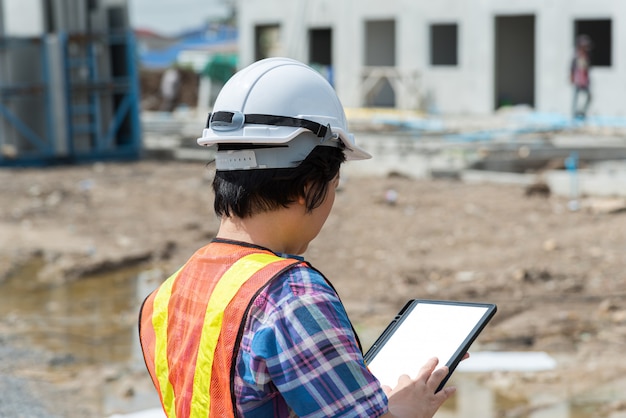 Woman construction engineer at construction site