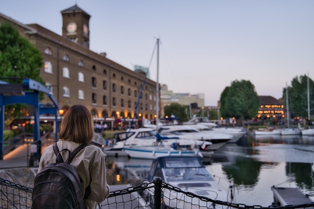 Woman contemplating lake in london