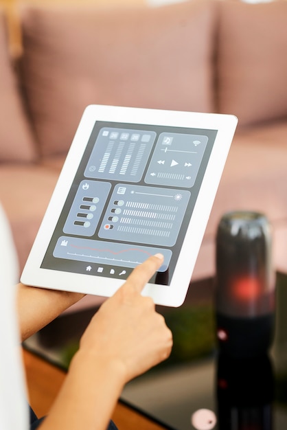 woman controlling the music with online application