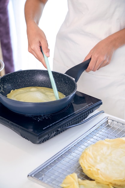 woman cooking in kitchen