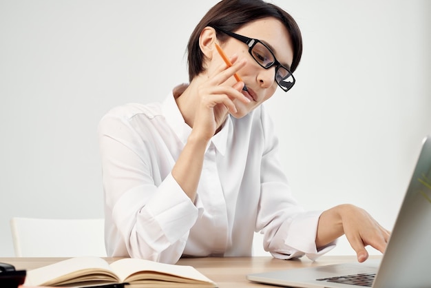 Woman in costume in front of laptop documents Professional Job isolated background