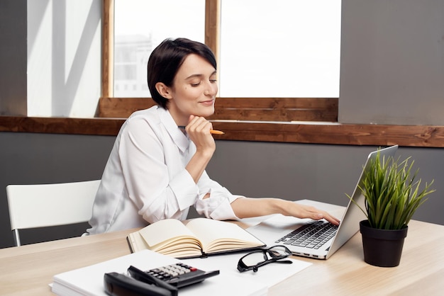 Woman in costume in front of laptop documents Professional Job Studio Lifestyle