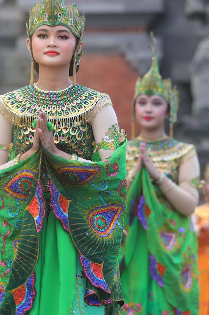 a woman in a costume with the word god on her chest