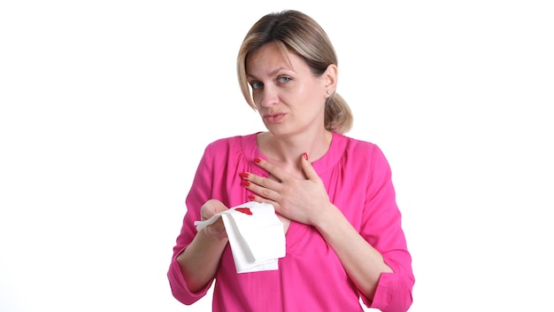 Woman coughs up blood and holds paper with blood