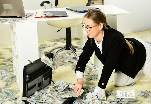 Woman counting money Financial success Tax service Business investment Office is littered with money Business challenges Owner of small business Accounting and banking Accountant office