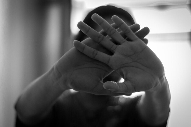 Woman covering face with hands