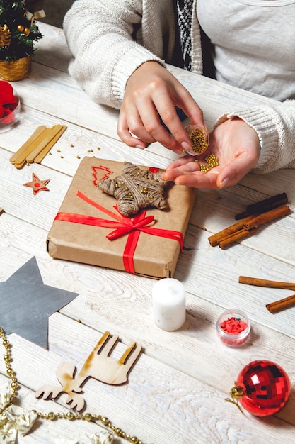 Woman create stylish christmas gifts