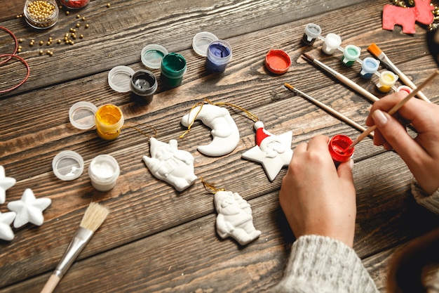 Woman creating stylish Christmas gifts